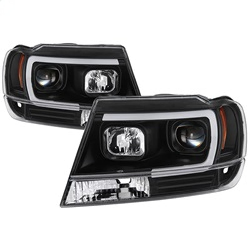 Spyder 5085221 fits Jeep 99-04 Grand Cherokee Projector Headlights - Light Bar