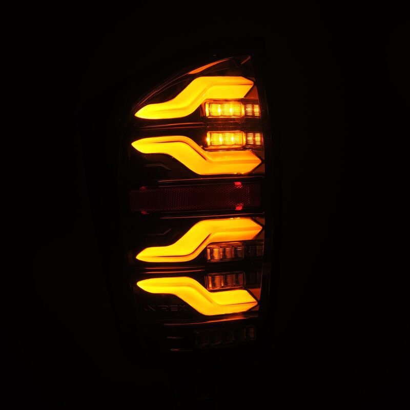 AlphaRex 680080 16-21 fits Toyota Tacoma LUXX LED Taillights Alpha Blk w/Acti
