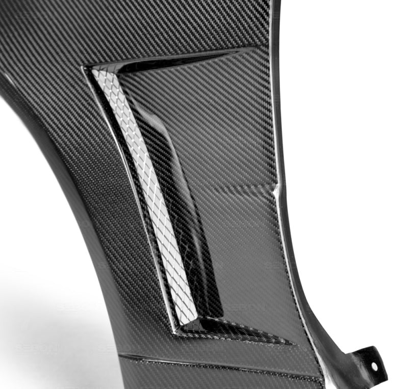 Seibon FF9901NSR34-NSW fits Nissan 99-01 Skyline R34 NSW-Style Carbon Fiber (Gloss Finish) Fenders (Pair)